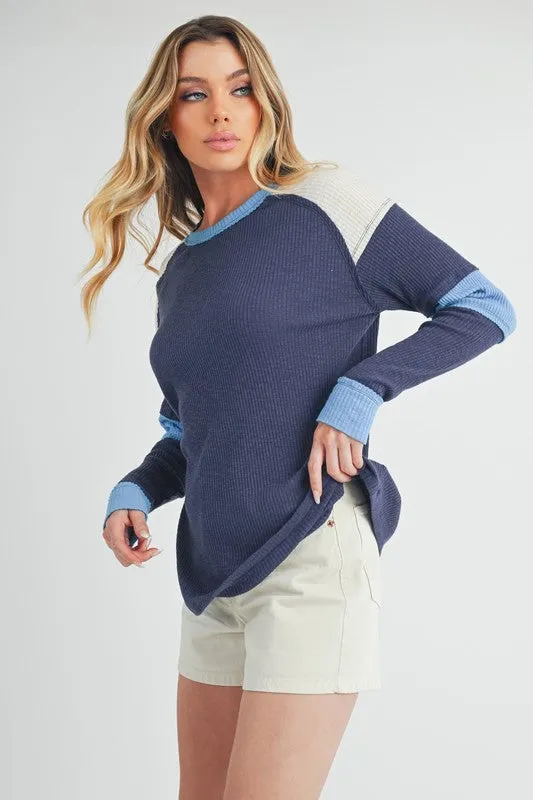 Aemi   Co Raw Seam Color Block Round Neck Knit Top
