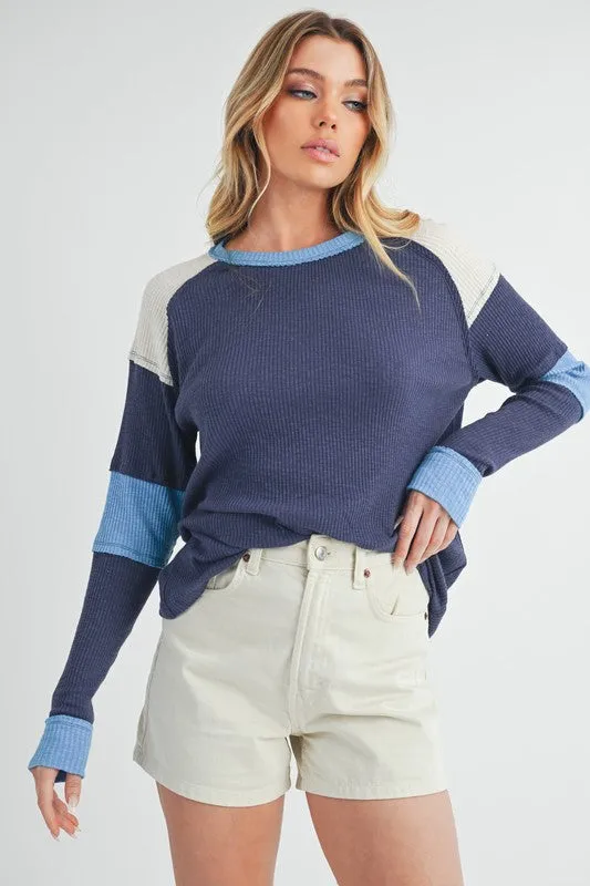 Aemi   Co Raw Seam Color Block Round Neck Knit Top